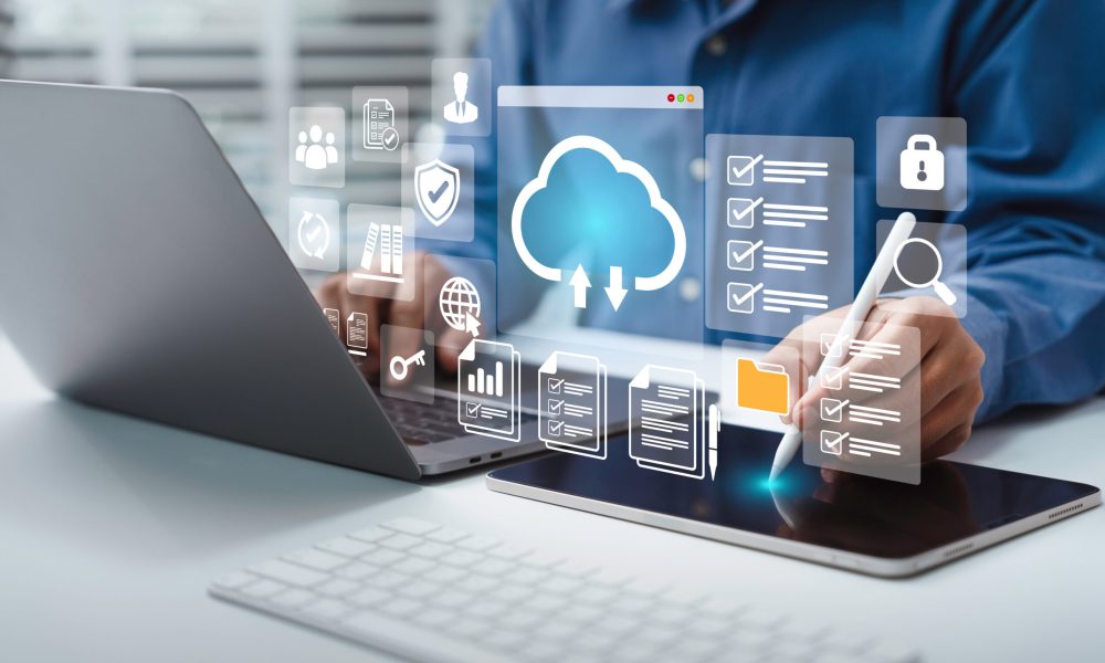 Businessman using a computer to Cloud service to document management and digital files storage and transfer. doc sharing and file access, backup and sync data, online documentation database technology